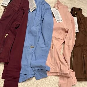 lululemon athletica Women's Jackets in Burgundy, Light Blue, Pink, and Brown
